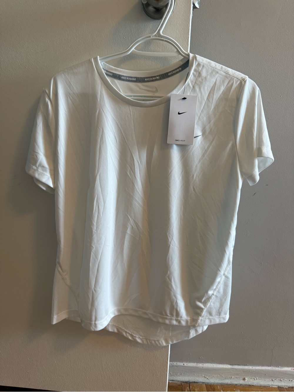 Nike Women’s White Short Sleeve Athletic Tee with Gray Swoosh